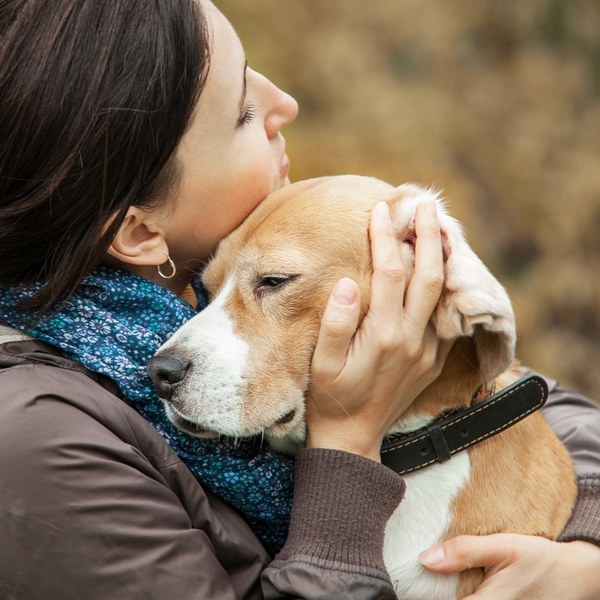Private pet cremation in Sydney, a woman holding her beagle close, Pet Memorial Australia